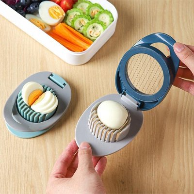 Coupe oeuf dur tranches précis'ine utilisé par une personne qui coupe des oeufs durs en tranches
