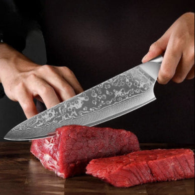 Couteau qui coupe de la viande du set de couteaux de cuisine