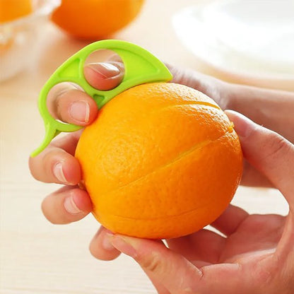 éplucheur agrumes vert pour éplucher une orange