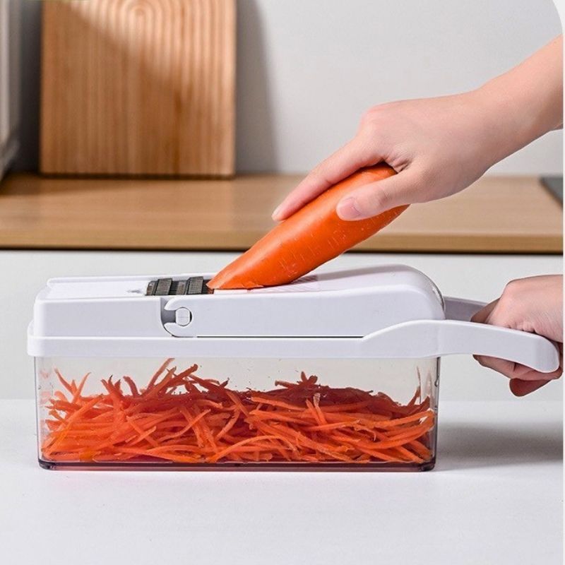 mandoline multifonction legu facil'ine râpe une carotte sur une table